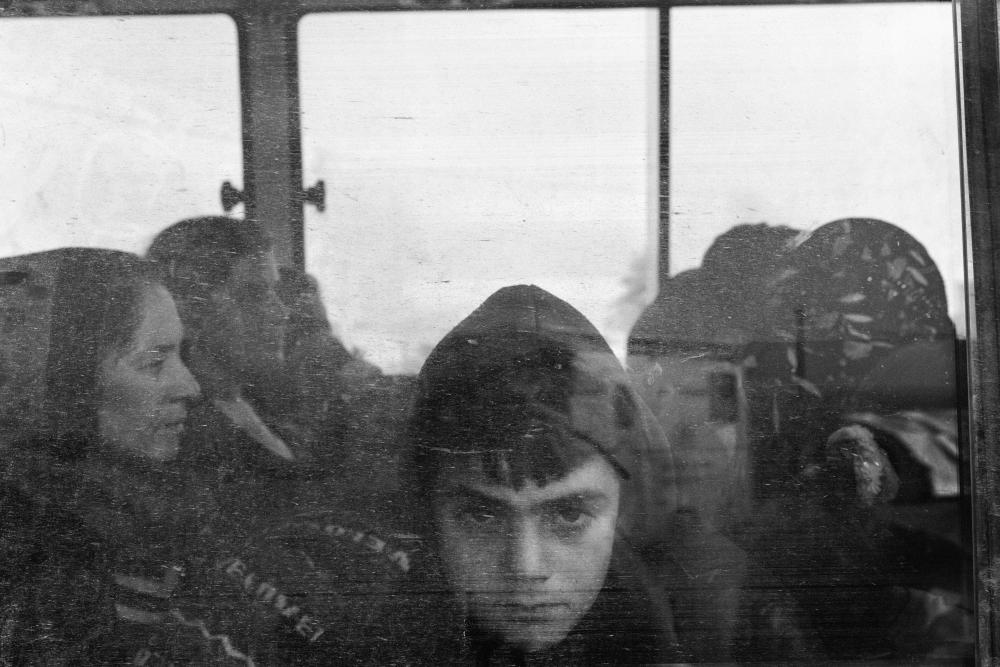 Magnum member Moises Saman took this image of refugees crossing the border between Syria and Iraq, and heading to Bardarash Camp aboard a bus operated by IOM, on 1 November 2019