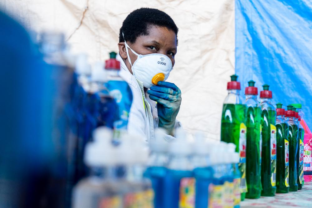 This portrait was taken in Harare, Zimbabwe in 2020. Martha Maocha runs a detergent manufacturing company and makes hand sanitizing gel