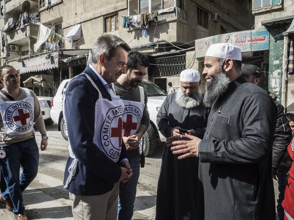 This image, taken by Jerome Sessini, features ICRC President Peter Maurer speaking to residents in a neighborhood in the outskirts of Damascus, Syria, on 26 February 26, 2016