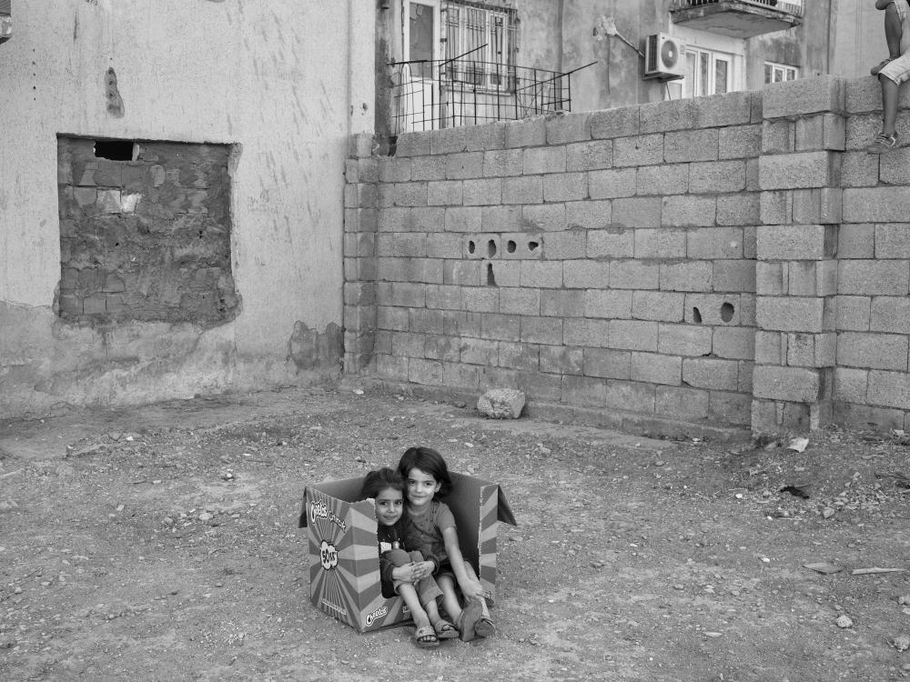 Those children playing were pictured in September 2020, by Emin Ozmen, in the province of Mardin, Turkey, at the border with Syria, where thousands of Syrians have sought refuge since the beginning of the war