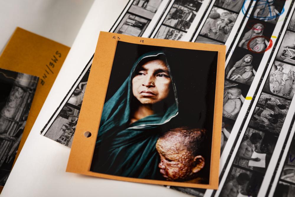 For over 70 years, the WHO has assigned professional photographers to document its efforts to advance health for all, today constituting a collection of more than 58'000 images. As part of the exhibition, this portrait of a mother and child suffering from smallpox was taken in the early 70s by renowned Indian photojournalist T. Satyan