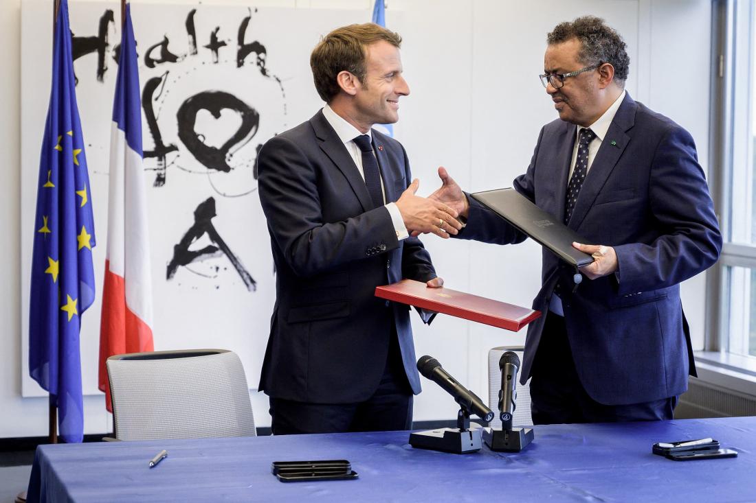 French President Emmanuel Macron with World Health Organization (WHO) Director-general Tedros Adhanom Ghebreyesus during the 108th (Centenary) Session of the International Labour Conference on June 11, 2019