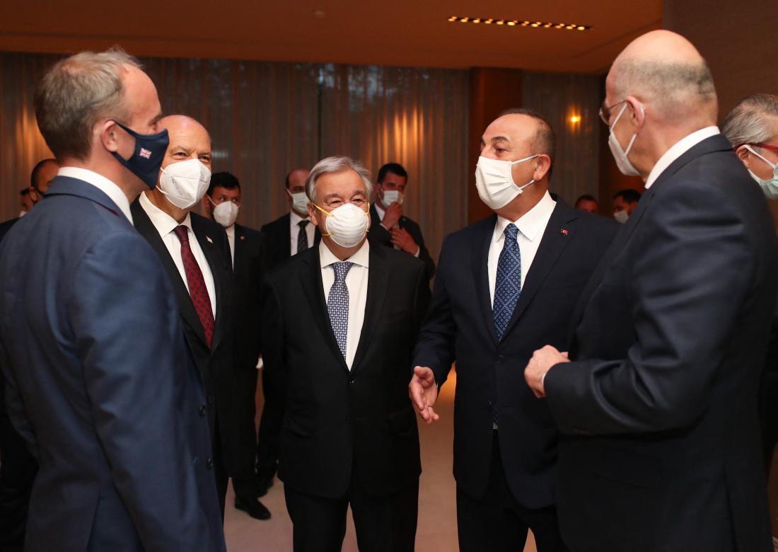 Turkish Cypriot President Ersin Tatar (2nd L), Turkish Foreign Minister Mevlut Cavusoglu (2nd R), British Foreign Secretary Dominic Raab (L), Greek Foreign Minister Nikos Dendias (R), and Greek Cypriot leader Nicos Anastasiades (not seen) attend a reception hosted by Secretary-General of United Nations Antonio Gutierrez (C) on 27 April 2021